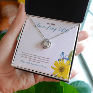 Create Precious Memories love knot necklace in hand