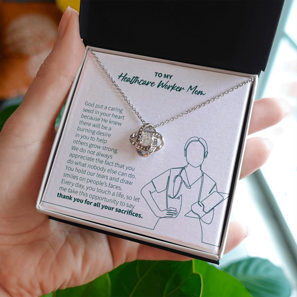 Caring Seed In Your Heart love knot necklace in hand