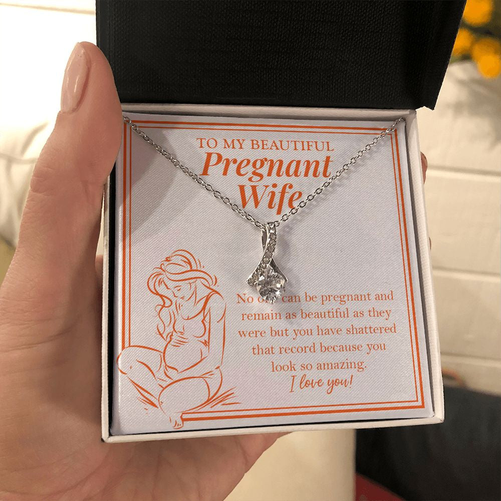A Beautiful Pregnant alluring beauty necklace in hand