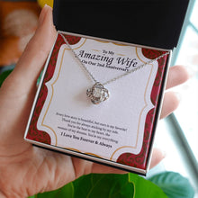 Load image into Gallery viewer, Every Story love knot necklace in hand
