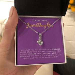 Straighten Your Crown alluring beauty necklace in hand