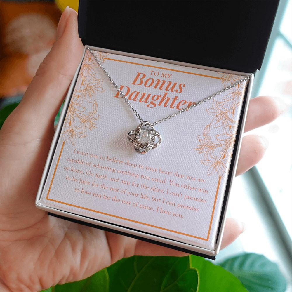 You Deserve True Happiness love knot necklace in hand
