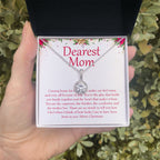 Warm And Cozy eternal hope necklace in hand