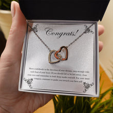 Load image into Gallery viewer, Move Confidently interlocking heart necklace in hand
